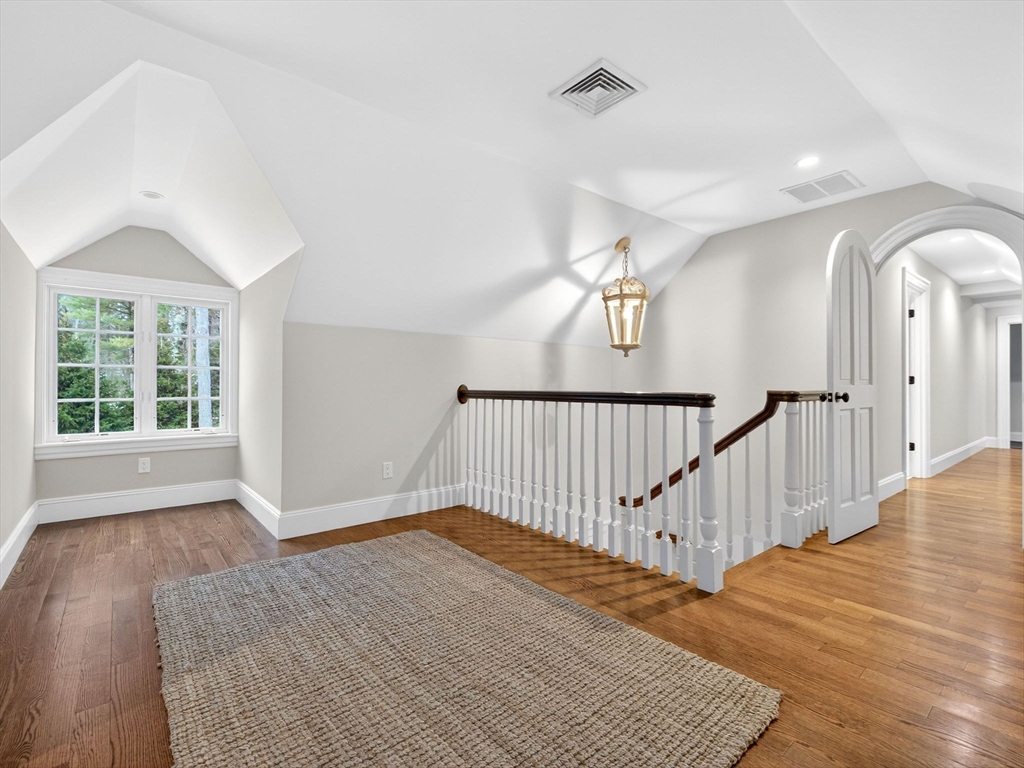 12 Winding River Circle Wellesley, MA 02482 - Photo 28 of 40 a view of a hallway with wooden floor and stairs