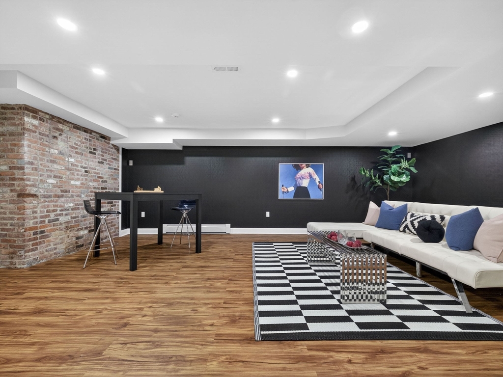 12 Winding River Circle Wellesley, MA 02482 - Photo 35 of 40 a bedroom with a bed and a flat screen tv