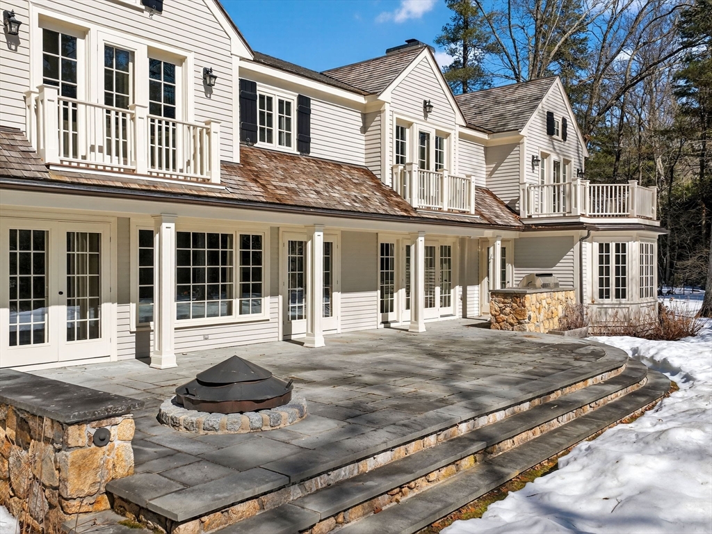 12 Winding River Circle Wellesley, MA 02482 - Photo 38 of 40 front view of a building with a yard