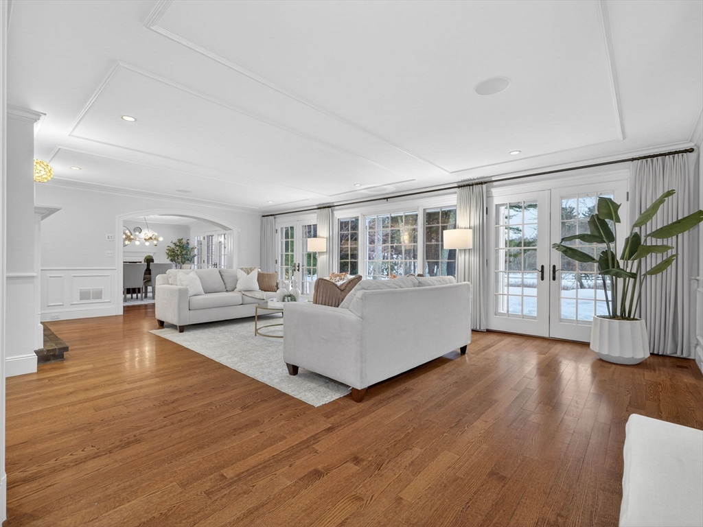 12 Winding River Circle Wellesley, MA 02482 - Photo 5 of 40 a living room with furniture wooden floor and a large window