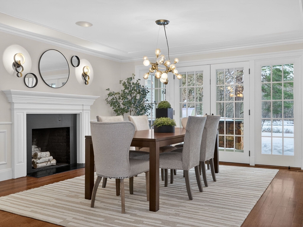 12 Winding River Circle Wellesley, MA 02482 - Photo 9 of 40 a view of a dining room with furniture a chandelier and wooden floor