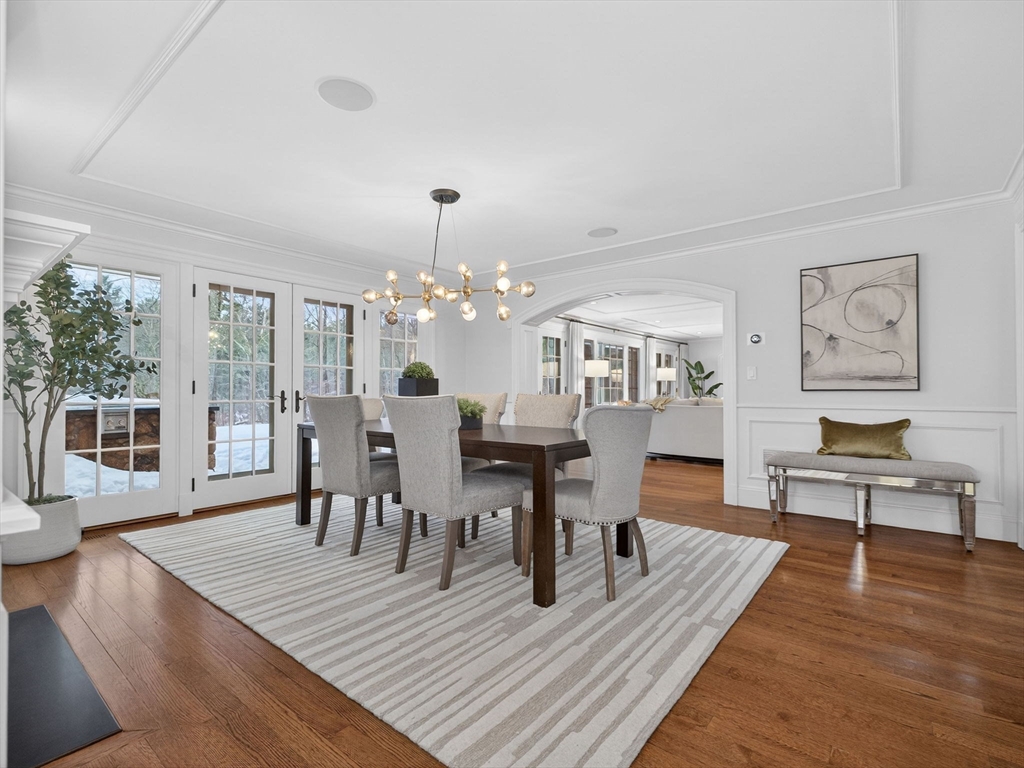 12 Winding River Circle Wellesley, MA 02482 - Photo 10 of 40 a view of a dining room with furniture wooden floor and chandelier