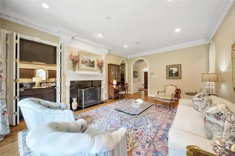 a living room with fireplace furniture and a fireplace