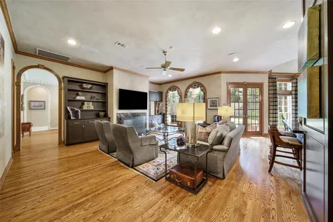 a living room with furniture fireplace and flat screen tv