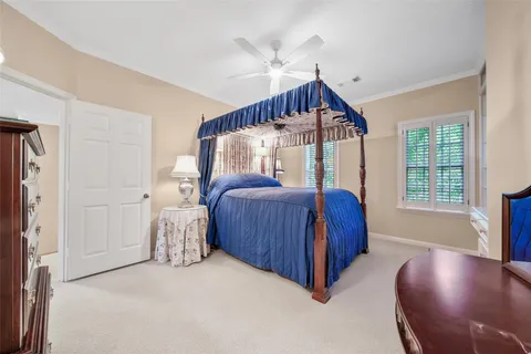 a view of a livingroom with furniture and a ceiling fan