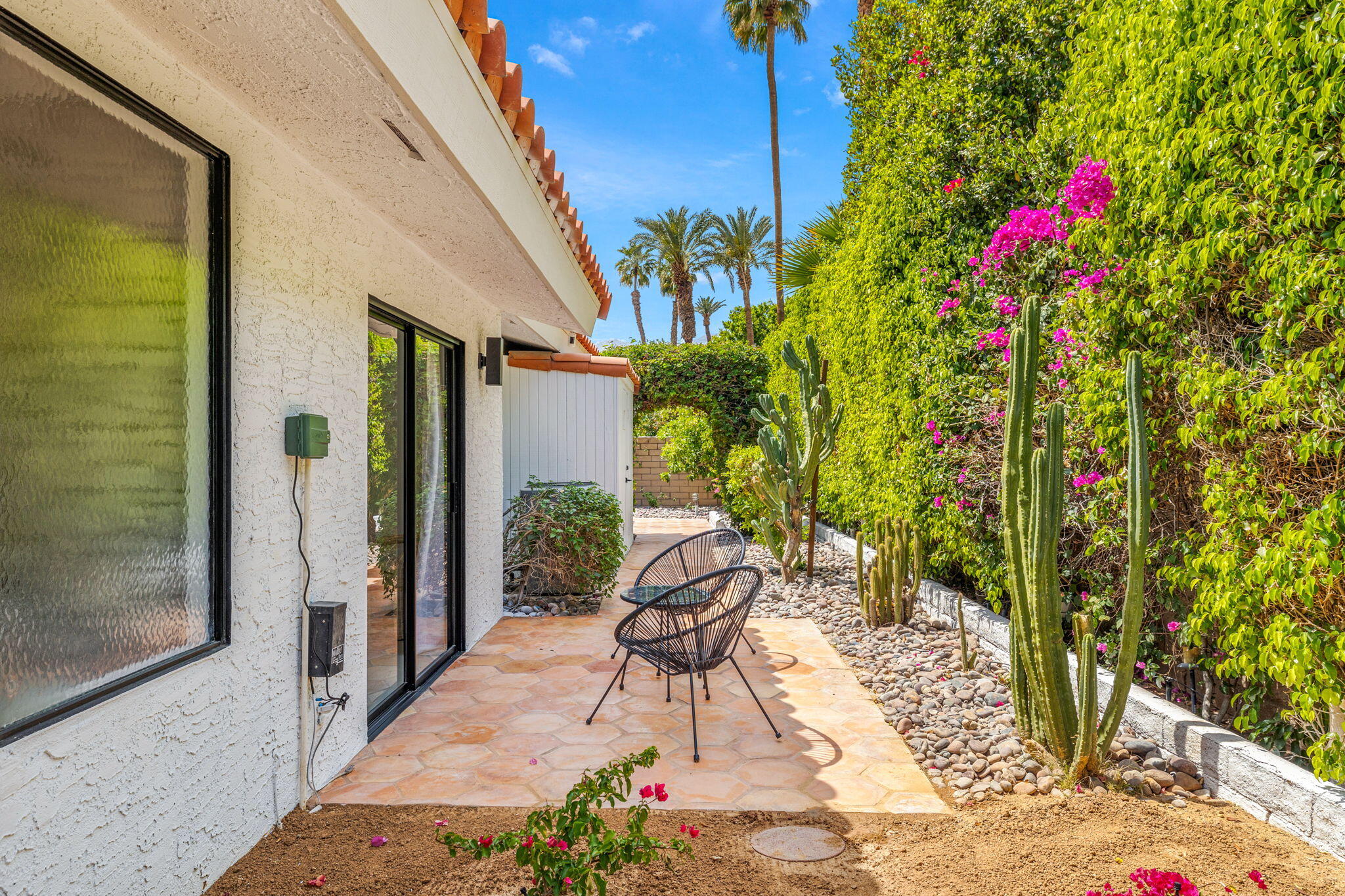34 Lincoln Place Rancho Mirage, CA 92270 - Photo 28 of 52 a view of a porch with chairs and potted plants