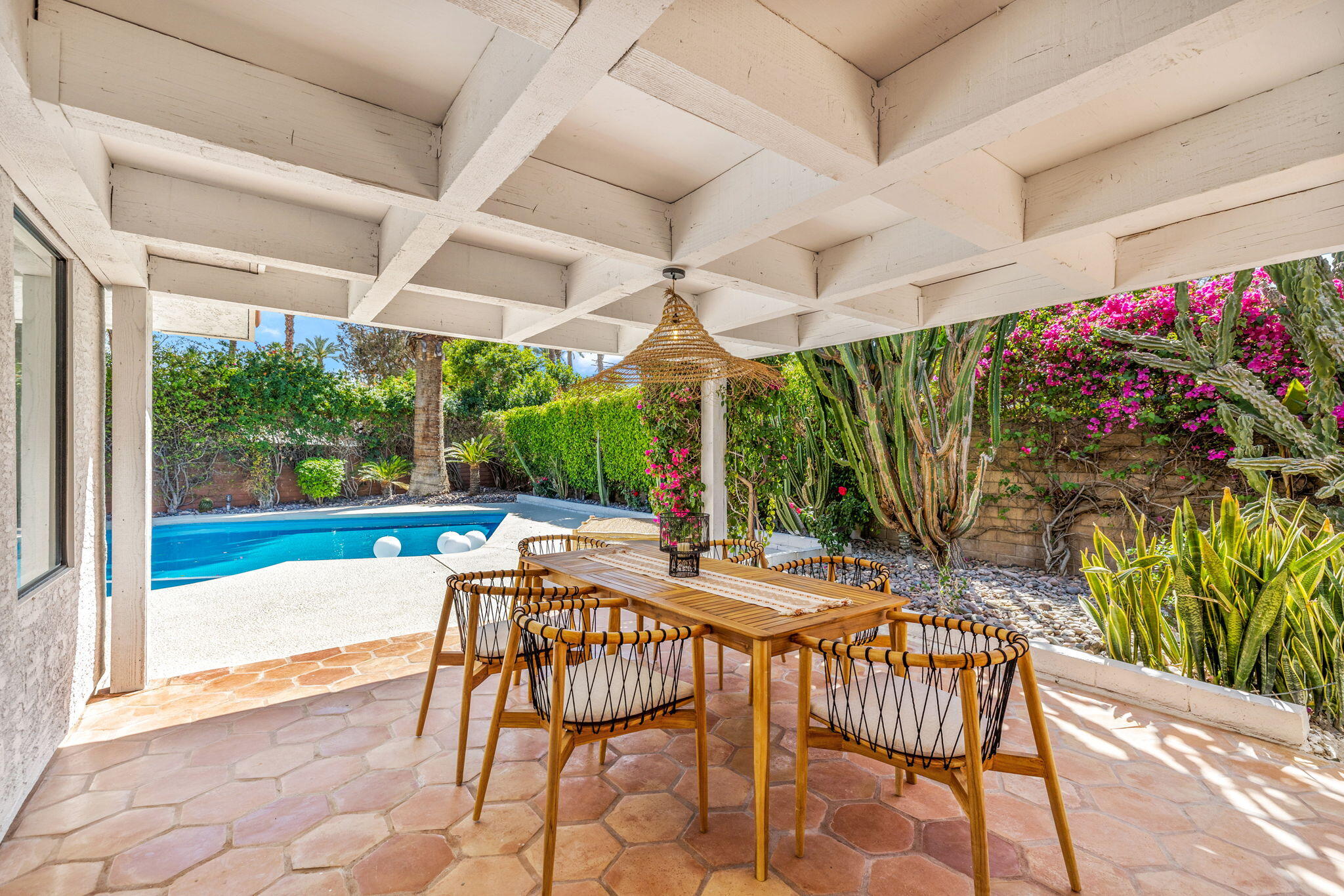 34 Lincoln Place Rancho Mirage, CA 92270 - Photo 39 of 52 a patio with a patio table and chairs