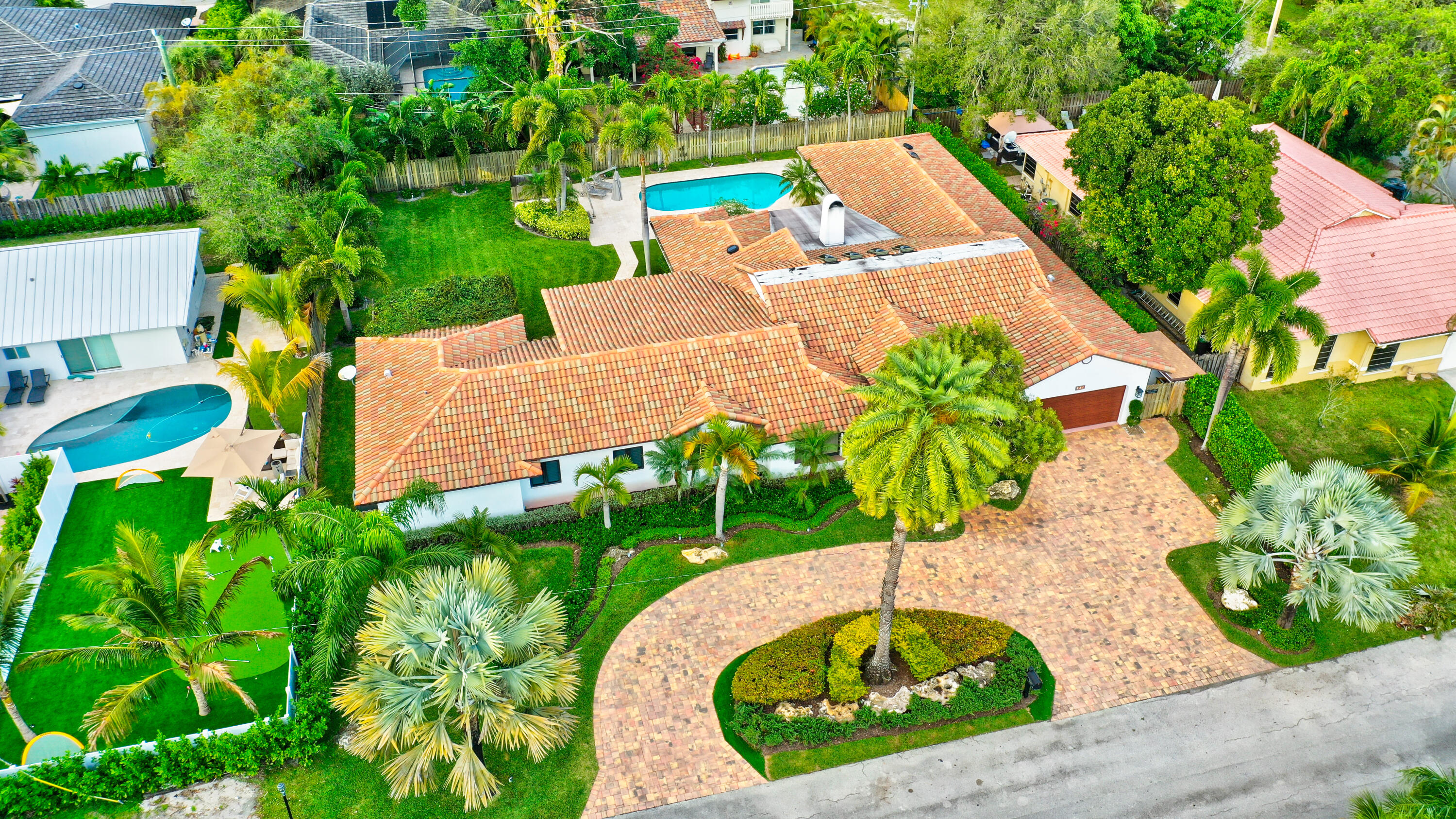 921 Southwest 20th Street Boca Raton, FL 33486 - Photo 7 of 56 an aerial view of a house with garden space and outdoor seating