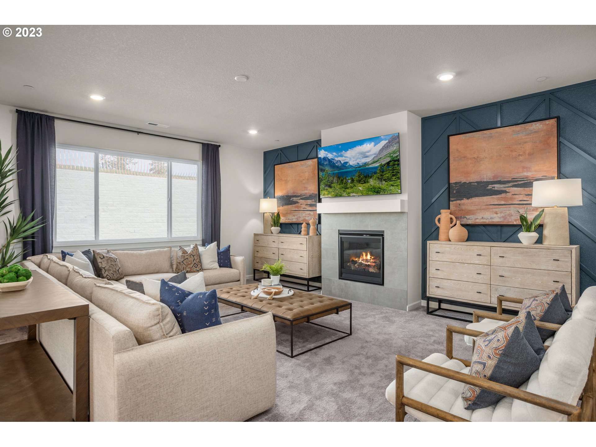 2711 South 9th Circle Ridgefield, WA 98642 - Photo 5 of 28 a living room with furniture a flat screen tv and a fireplace