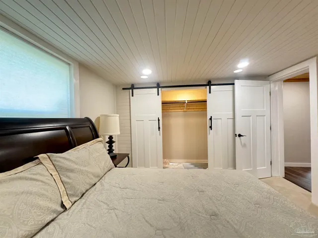 a view of a livingroom with a refrigerator