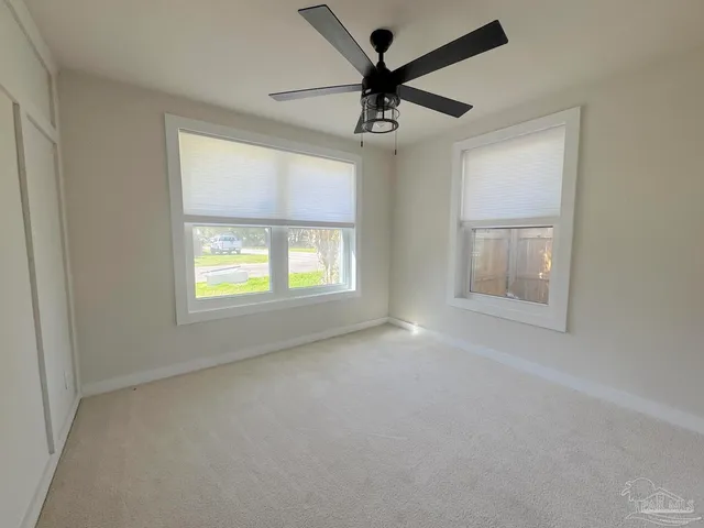 a view of lot of kitchen with wooden floor