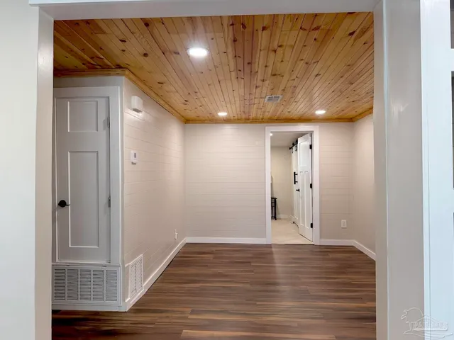 a kitchen with a sink stove and refrigerator
