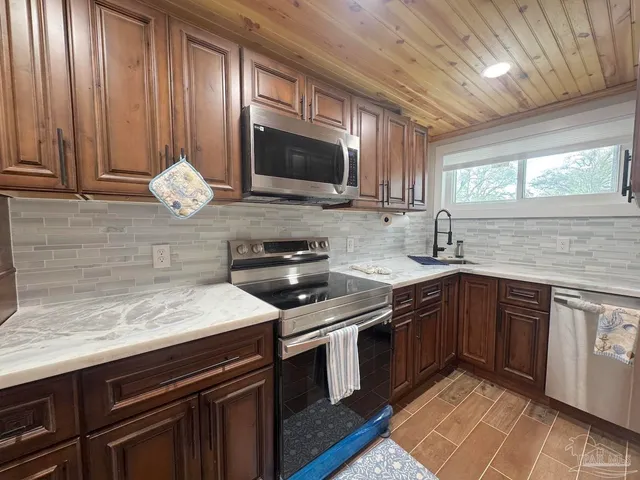 a kitchen with a stove and a microwave