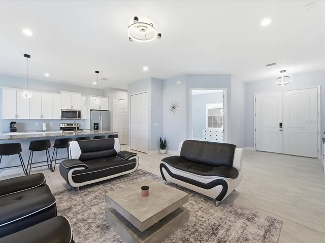 a living room with furniture and a rug