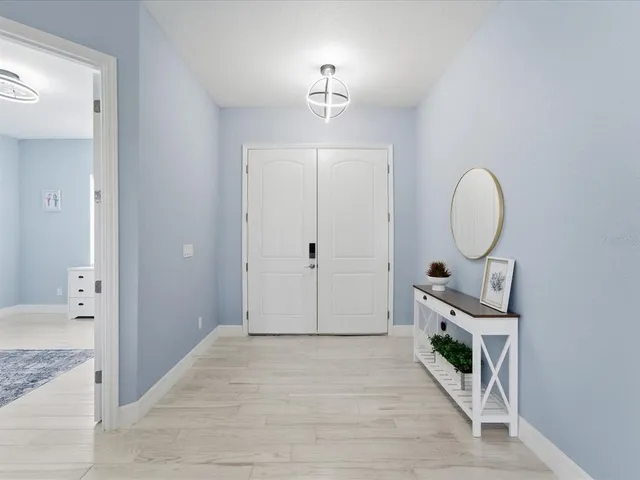 a spacious bathroom with a mirror and a shower