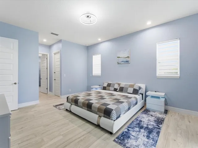 a bedroom with a bed and a table