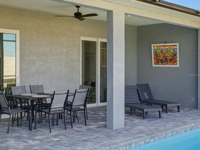 a view of a dinning table and chairs in the room