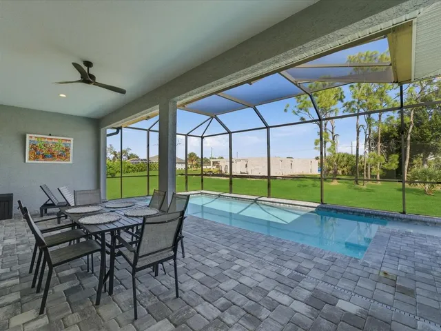 a view of yard with an outdoor dining space