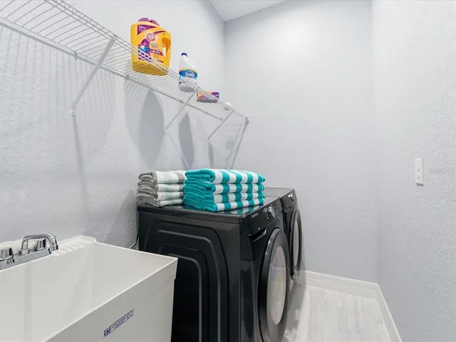 a utility room with dryer and washer