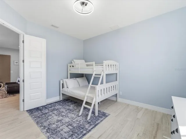 a bed room with a bed and a view of bedroom