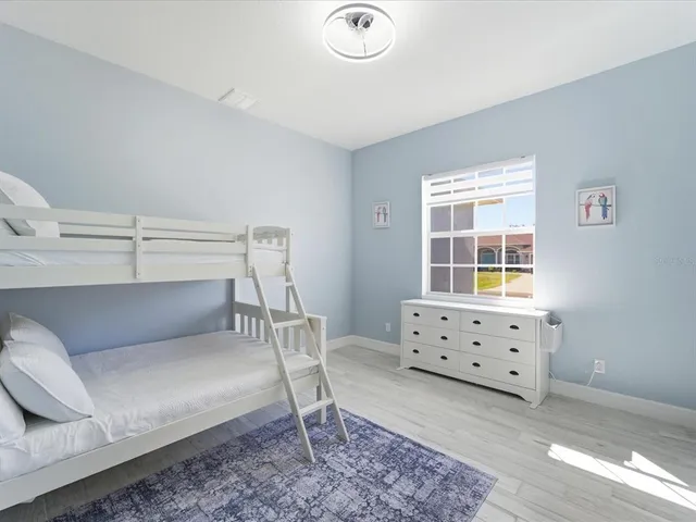 a bedroom with a bed and a couch