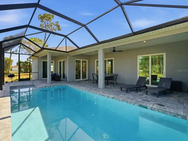 a view of a backyard with a patio