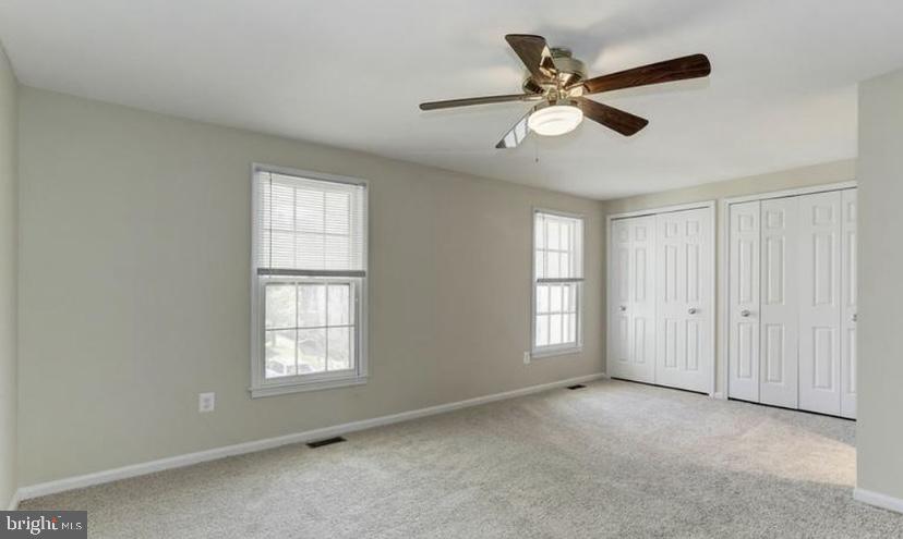 613 Concerto Lane Silver Spring, MD 20901 - Photo 12 of 23 a view of an empty room with a window