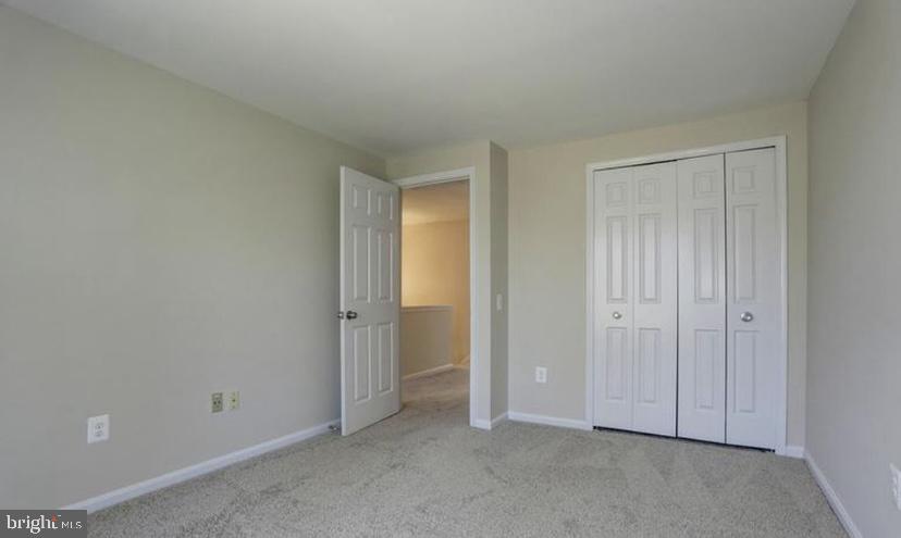 613 Concerto Lane Silver Spring, MD 20901 - Photo 14 of 23 an empty room with closet area