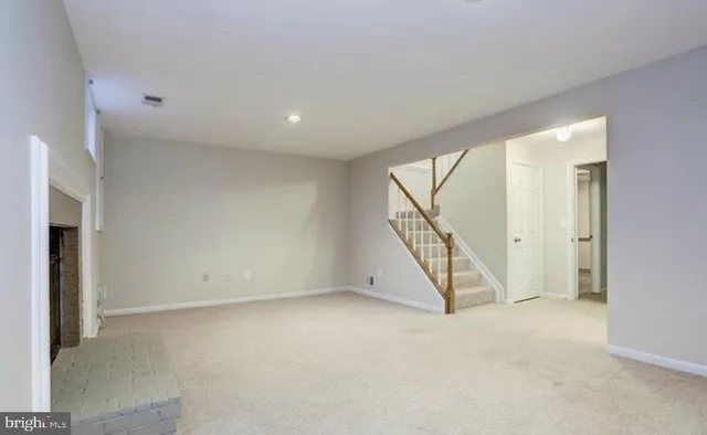 an empty room with staircase
