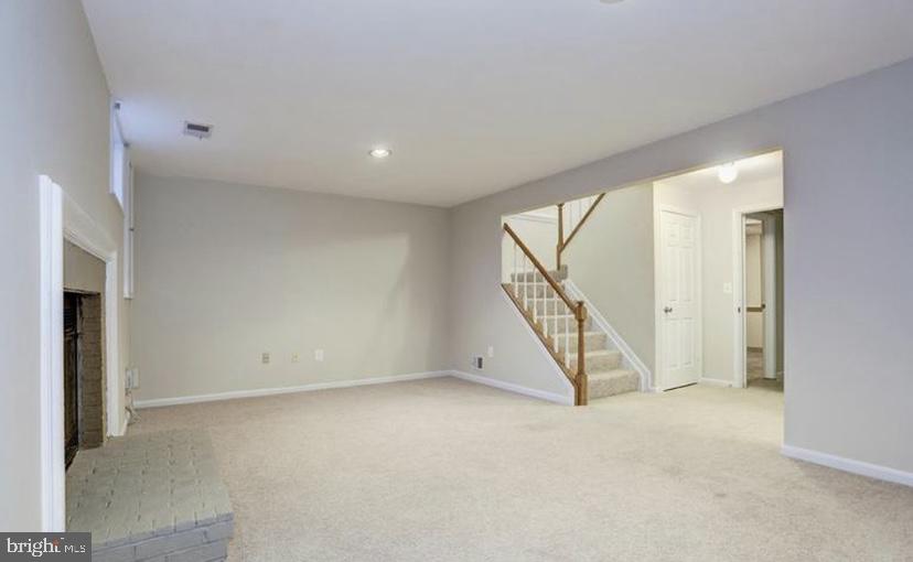 613 Concerto Lane Silver Spring, MD 20901 - Photo 20 of 23 an empty room with staircase