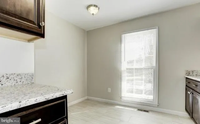 a room with a sink storage and utility