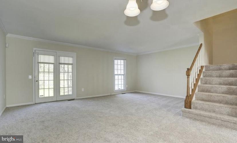 613 Concerto Lane Silver Spring, MD 20901 - Photo 7 of 23 a view of an empty room with a window