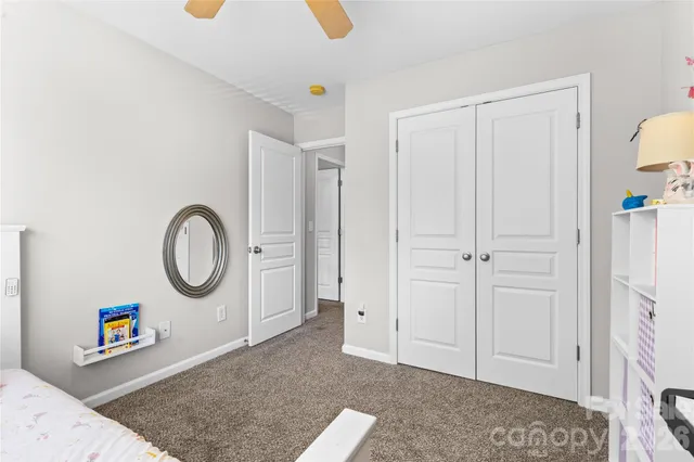 a view of a livingroom with an entryway and a fireplace