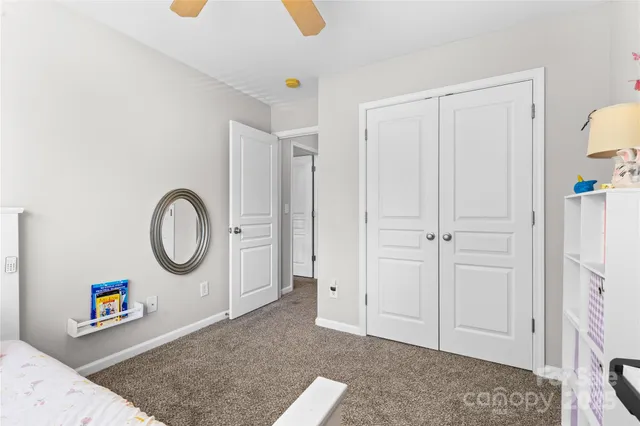 a view of a livingroom with an entryway and a fireplace