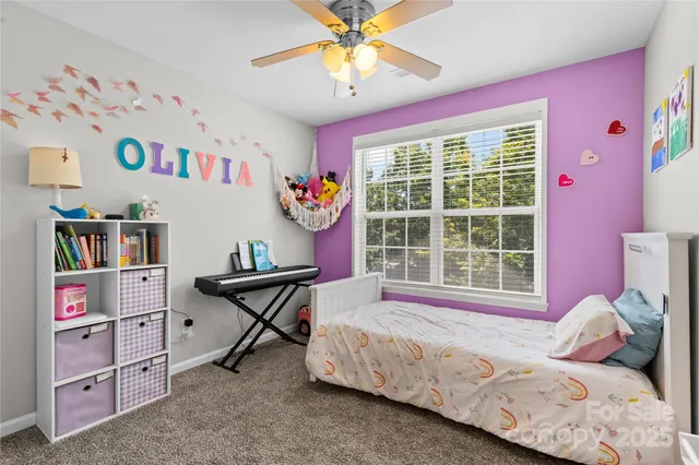 a bedroom with furniture and a window