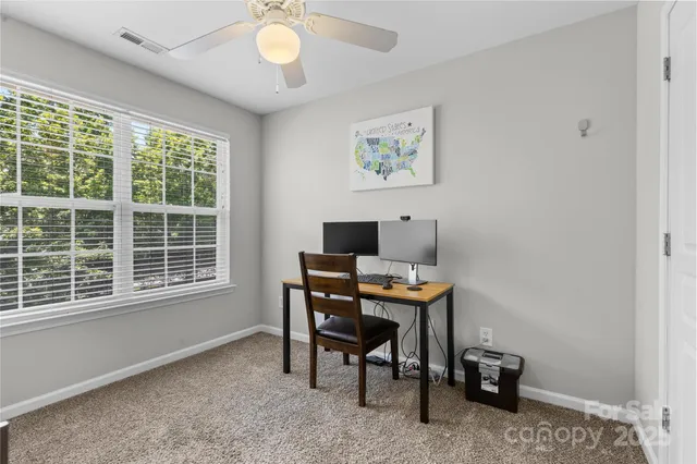 a workspace with furniture and a window