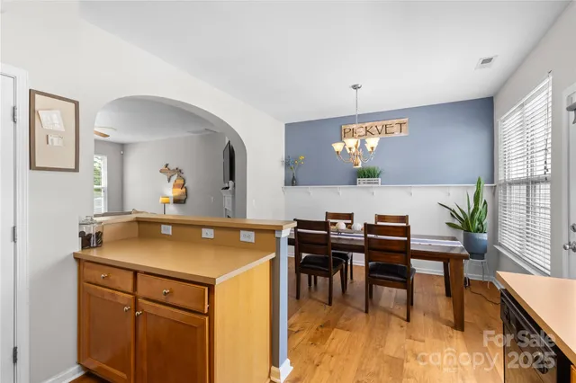 a view of kitchen and dining room with furniture