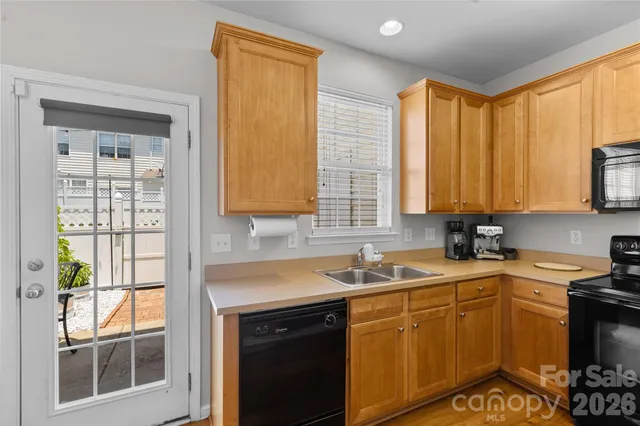 a kitchen with a sink stove and microwave