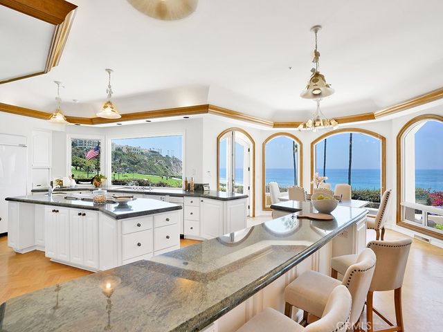 a living room with fireplace furniture and a large window