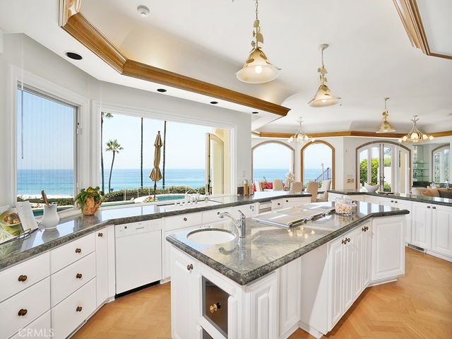 a living room with furniture a fireplace and lots of tables