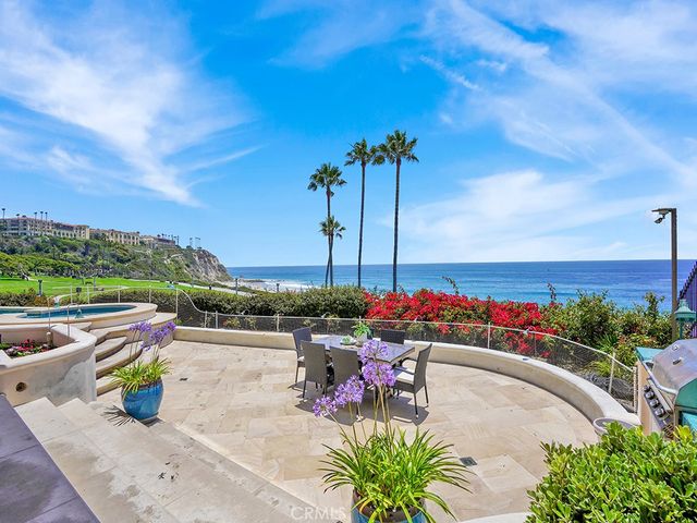 an aerial view of a house with a ocean view