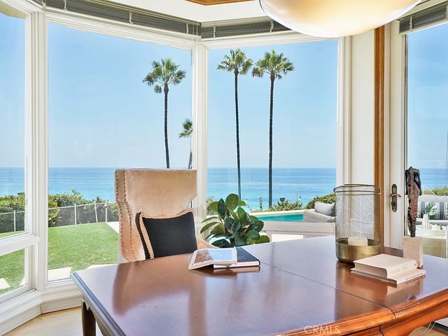 a bedroom with bed and a large mirror