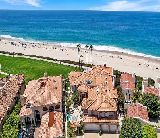 an aerial view of a house with a ocean view