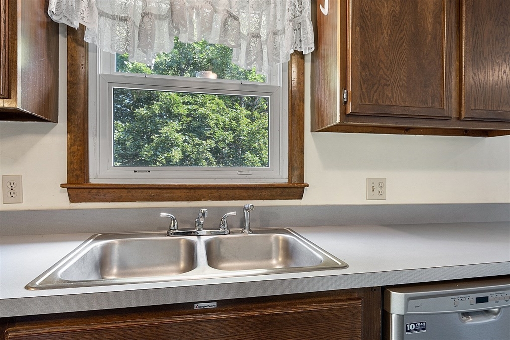 4 Ridgemont Drive Londonderry, NH 03053 - Photo 12 of 33 a kitchen with a sink and a window
