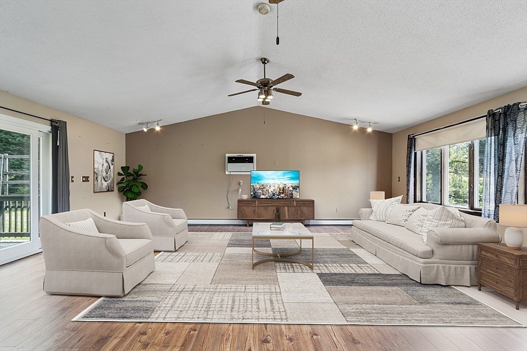 4 Ridgemont Drive Londonderry, NH 03053 - Photo 13 of 33 a living room with furniture and a window