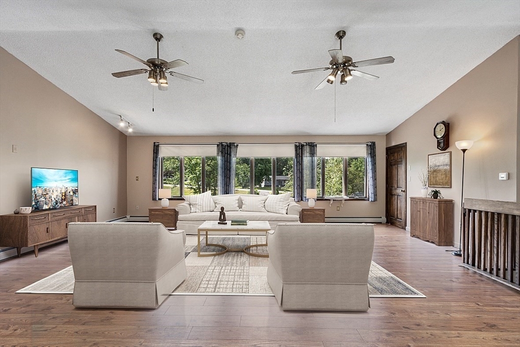4 Ridgemont Drive Londonderry, NH 03053 - Photo 14 of 33 a living room with furniture and a large window