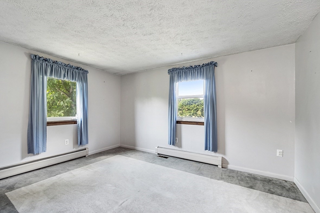 4 Ridgemont Drive Londonderry, NH 03053 - Photo 22 of 33 a view of an empty room with a window