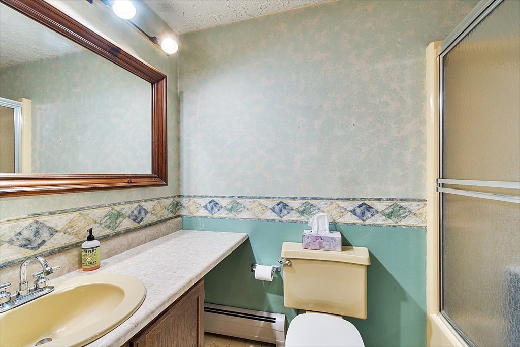 4 Ridgemont Drive Londonderry, NH 03053 - Photo 24 of 33 a bathroom with a granite countertop toilet sink and mirror