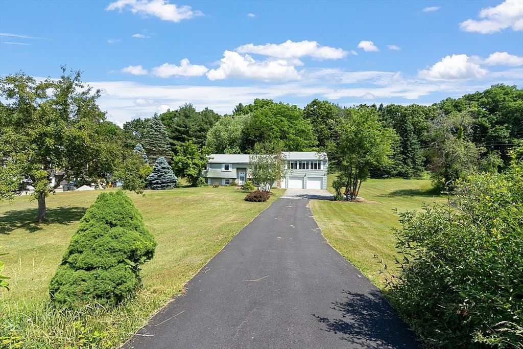 4 Ridgemont Drive Londonderry, NH 03053 - Photo 3 of 33 a view of a swimming pool with a yard