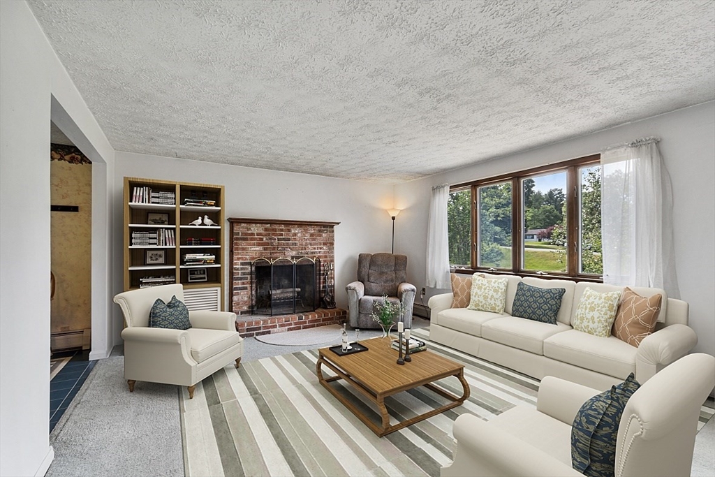 4 Ridgemont Drive Londonderry, NH 03053 - Photo 8 of 33 a living room with furniture and a large window